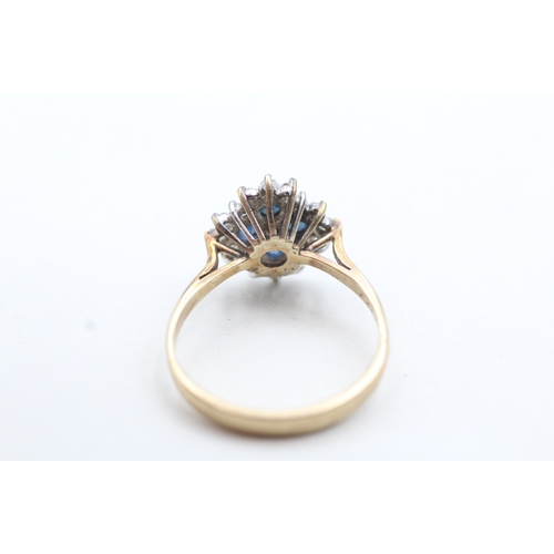 128 - 9ct gold cluster set diamond and blue gemstone ring (3.7g) Size S