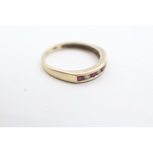 129 - 9ct gold channel set diamond and pink gemstone ring (1.6g) Size N