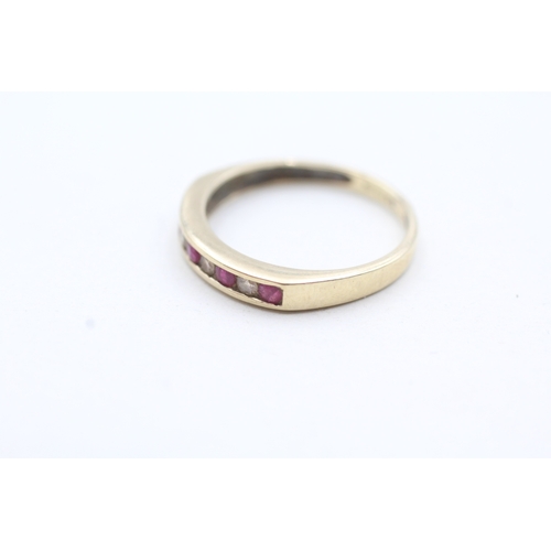 129 - 9ct gold channel set diamond and pink gemstone ring (1.6g) Size N