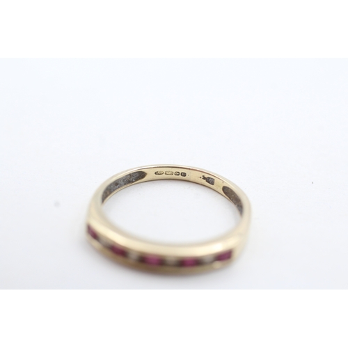 129 - 9ct gold channel set diamond and pink gemstone ring (1.6g) Size N