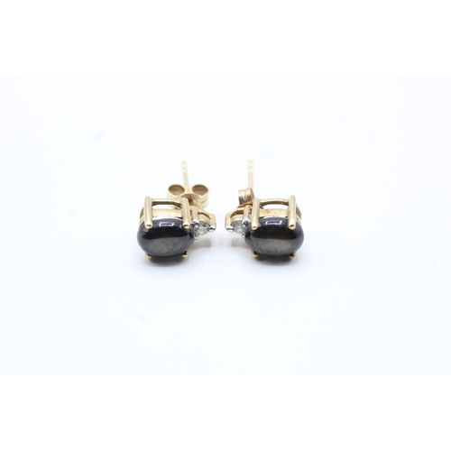 134 - 9ct gold cats eye gemstone and diamond stud earrings (2g)