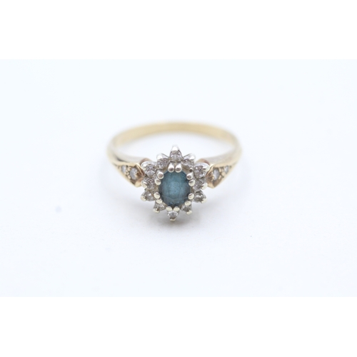 135 - 9ct gold blue gemstone and diamond halo ring (2.8g) Size M