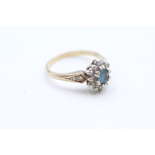 135 - 9ct gold blue gemstone and diamond halo ring (2.8g) Size M