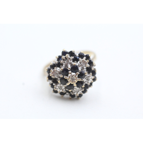 147 - 9ct gold diamond and blue gemstone cluster ring (4.4g) Size O