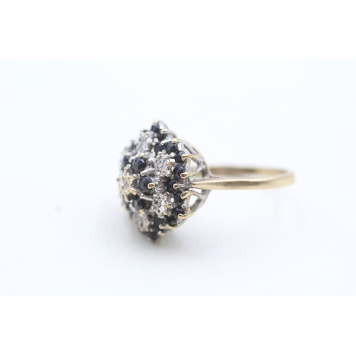 147 - 9ct gold diamond and blue gemstone cluster ring (4.4g) Size O