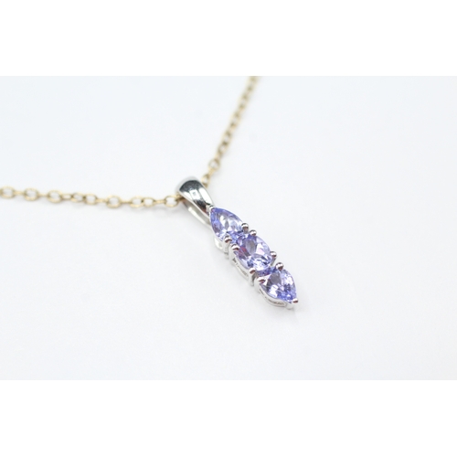 179 - 14ct gold tanzanite pendant on 9ct gold chain (1.7g)