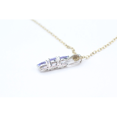 179 - 14ct gold tanzanite pendant on 9ct gold chain (1.7g)