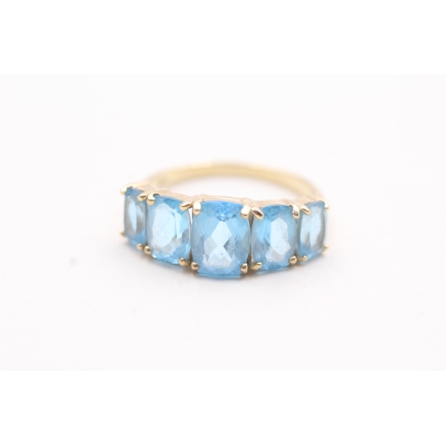 182 - 9ct gold with five blue gemstone set ring (3.1g)