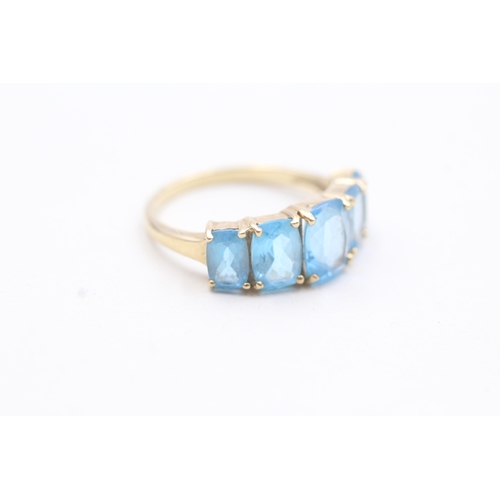 182 - 9ct gold with five blue gemstone set ring (3.1g)