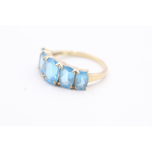 182 - 9ct gold with five blue gemstone set ring (3.1g)