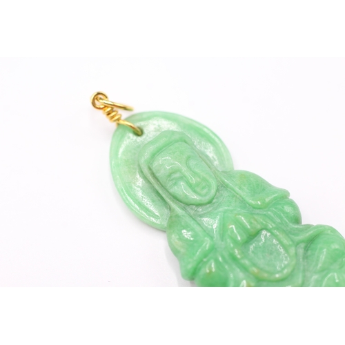 187 - 14ct gold carved jade pendant with gold bail (6.6g)