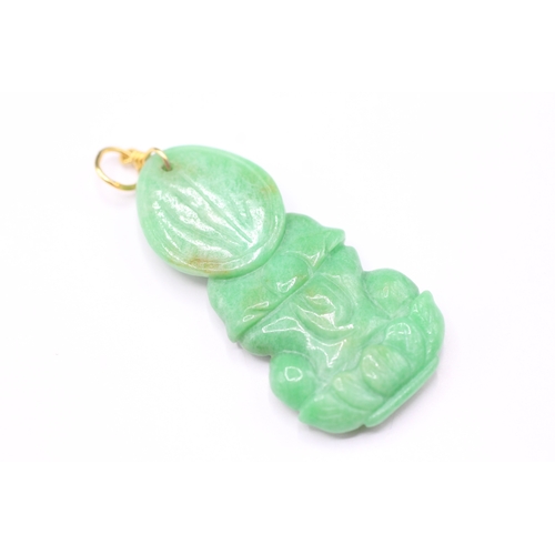 187 - 14ct gold carved jade pendant with gold bail (6.6g)