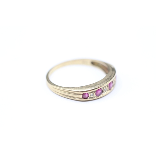 196 - 9ct gold flush set pink gemstone and diamond ring (1.8g) Size O 1/2