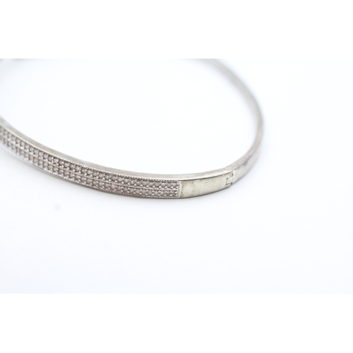 201 - 9ct gold diamond two row bangle (9.2g)