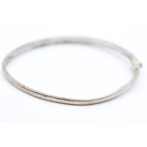 201 - 9ct gold diamond two row bangle (9.2g)