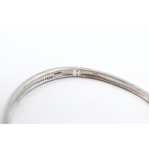 201 - 9ct gold diamond two row bangle (9.2g)