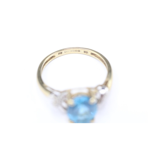 206 - 9ct gold blue gemstone and diamond twist ring (2.9g) Size Q