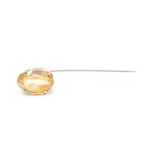 216 - 9ct gold yellow gemstone stick pin (1.9g)