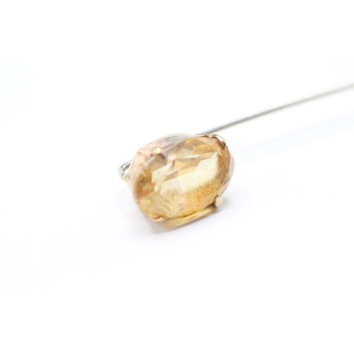 216 - 9ct gold yellow gemstone stick pin (1.9g)