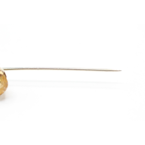 216 - 9ct gold yellow gemstone stick pin (1.9g)