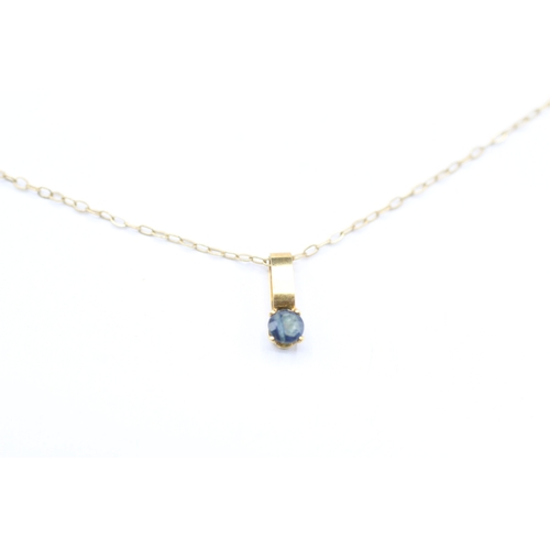 227 - 9ct gold and sapphire pendant on chain (0.5g)