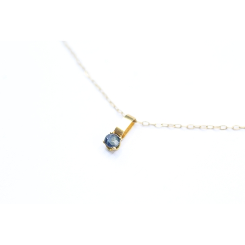 227 - 9ct gold and sapphire pendant on chain (0.5g)