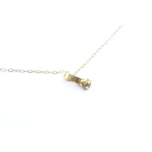 227 - 9ct gold and sapphire pendant on chain (0.5g)