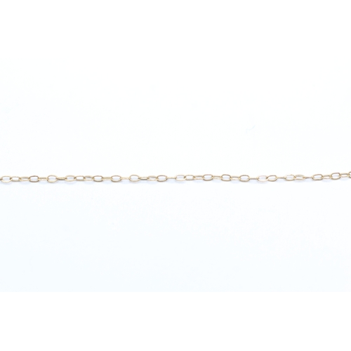 227 - 9ct gold and sapphire pendant on chain (0.5g)