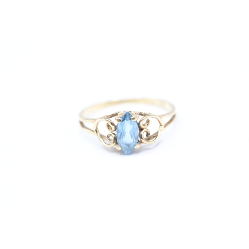 242 - 9ct gold blue gemstone set ring (1.2g) Size M