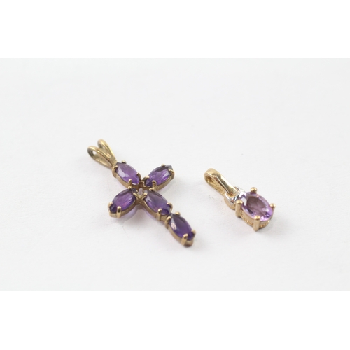 245 - 2 x 9ct gold amethyst pendants (1.7g)