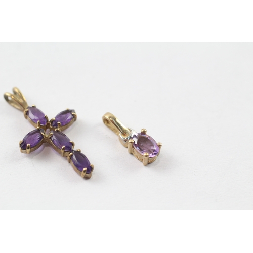 245 - 2 x 9ct gold amethyst pendants (1.7g)