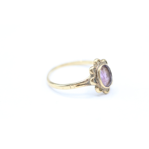 248 - 9ct gold and purple gemstone ring (1.6g) Size Q