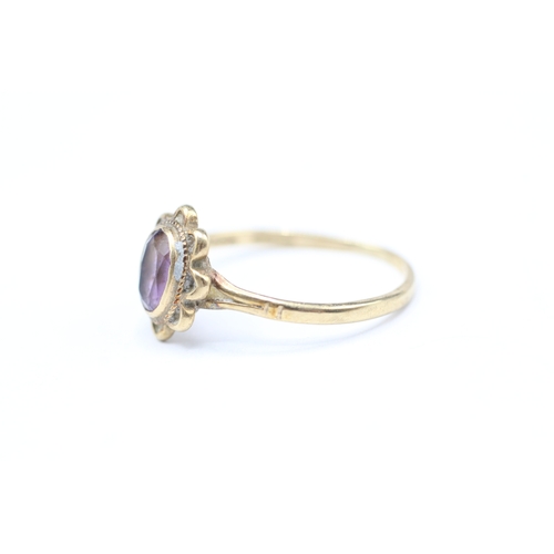 248 - 9ct gold and purple gemstone ring (1.6g) Size Q