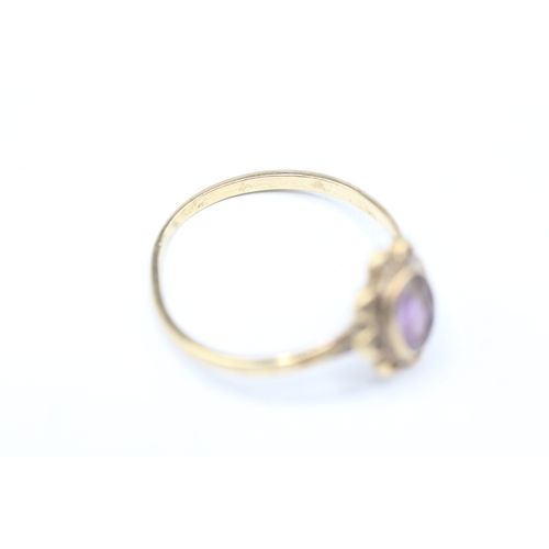 248 - 9ct gold and purple gemstone ring (1.6g) Size Q