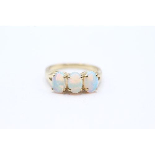 28 - 9ct gold and three stone opal ring (2.9g) Size N