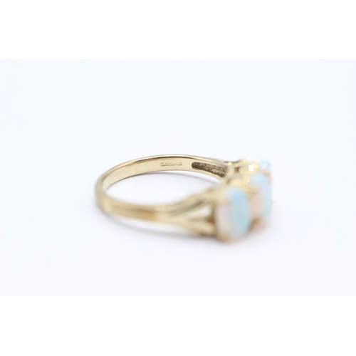 28 - 9ct gold and three stone opal ring (2.9g) Size N