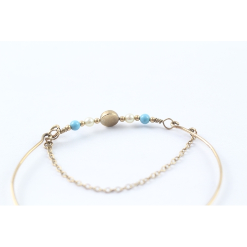 29 - 9ct gold turquoise and pearl bangle (2.3g)