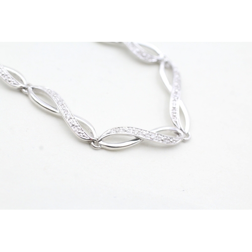 33 - 9ct white gold diamond twist bracelet (5.2g)