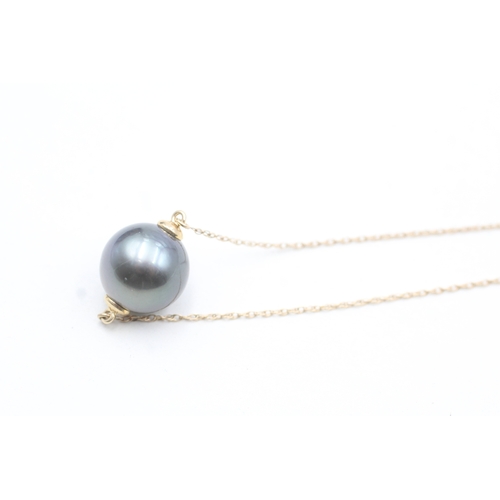 38 - 9ct gold cultured pearl drop pendant on chain (5.6g)