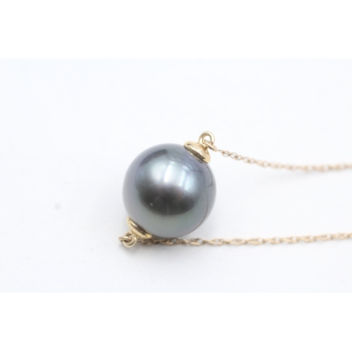 38 - 9ct gold cultured pearl drop pendant on chain (5.6g)