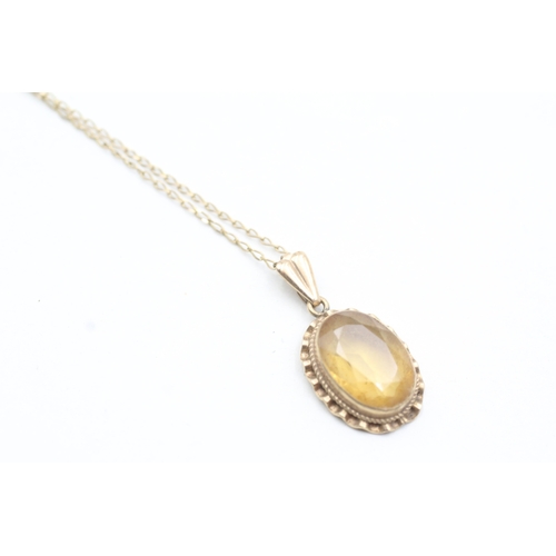 51 - 9ct gold citrine pendant on chain (2.9g)