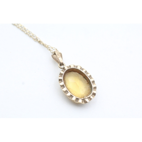 51 - 9ct gold citrine pendant on chain (2.9g)