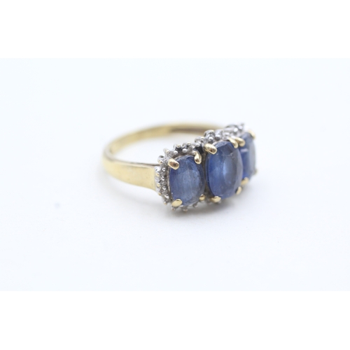 56 - 9ct gold ring with three blue gemstones surrounded by diamonds (3g) Size L 1/2