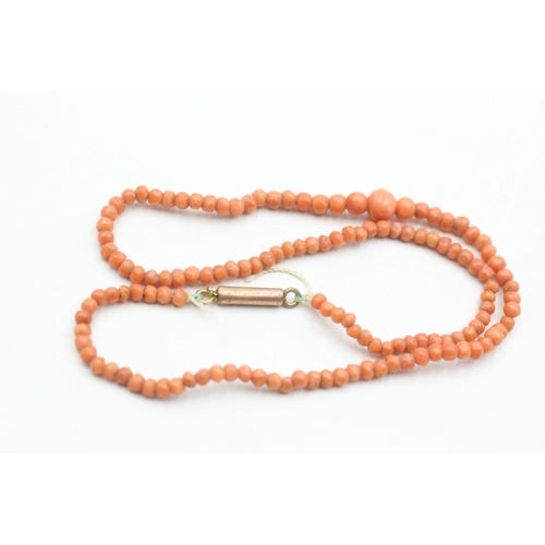 69 - 9ct gold coral beaded necklace (5.2g)