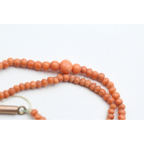 69 - 9ct gold coral beaded necklace (5.2g)