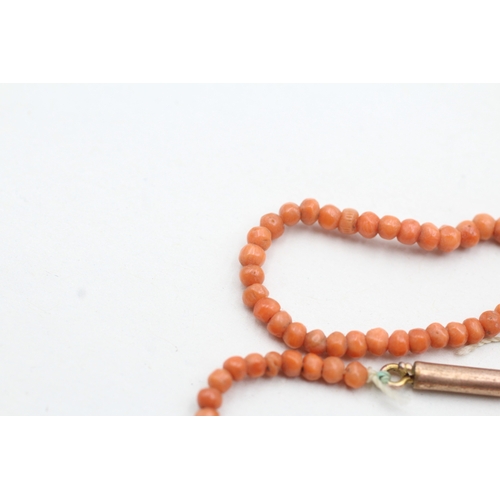 69 - 9ct gold coral beaded necklace (5.2g)