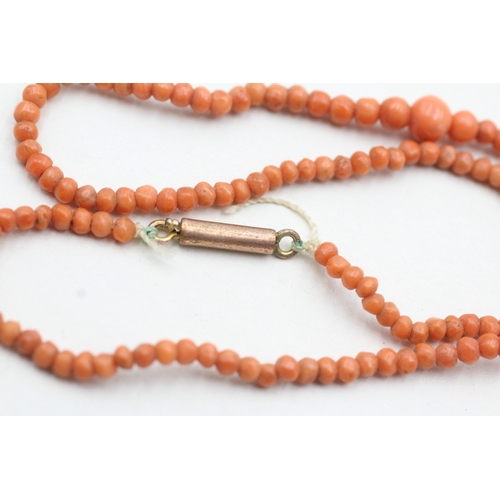 69 - 9ct gold coral beaded necklace (5.2g)