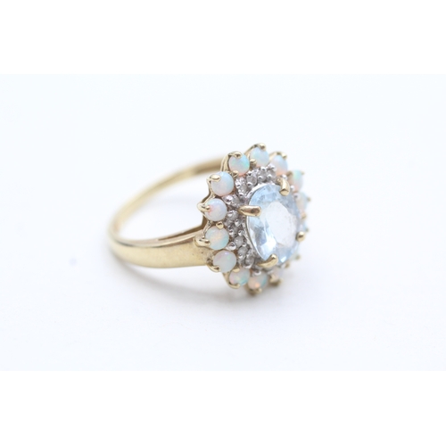 7 - 9ct gold opal, diamond and blue gemstone halo ring (3.7g) Size P