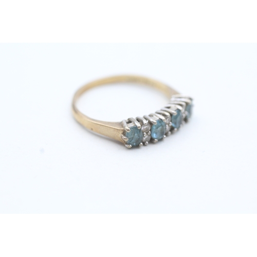 76 - 9ct gold diamond and blue gemstone row set ring (2.4g) Size P