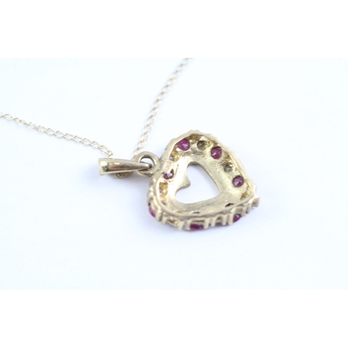 13 - 9ct gold ruby and diamond heart shaped pendant on chain